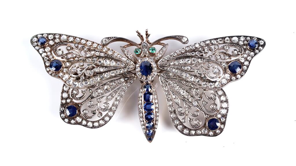 This 19th-century butterfly brooch is set with rose-cut diamonds and graduated facet-cut sapphires. 19th-century sapphire and diamond butterfly brooch