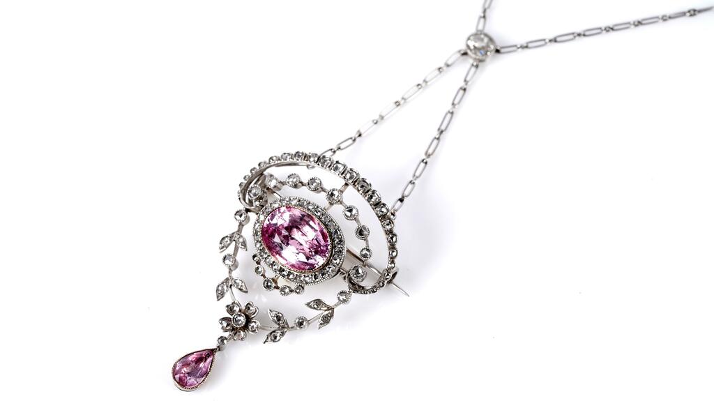 This Belle Époque piece is both a pendant and a brooch. Belle Époque ink topaz and diamond pendant brooch