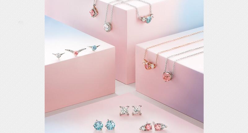 This picture provided by De Beers shows a selection of Lightbox Jewelry, the line of diamond fashion jewelry set with lab-grown white, pink and blue diamonds created by Element Six. The line will initially be sold direct to consumers online beginning this fall. 20180529_Lightbox-Jewelry.jpg