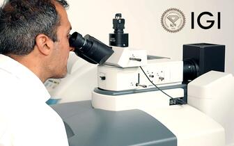 Man at International Gemological Institute microscope