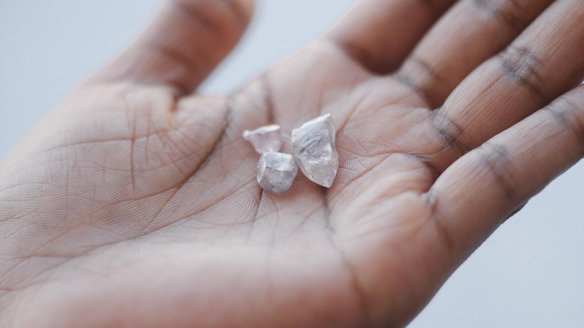 De Beers rough diamonds in someone’s hand 