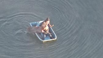 Two people in a rowboat