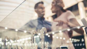 Stock image of couple shopping for jewelry  