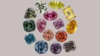 These 15 diamonds are part of the Winston Fancy Color Diamond Collection, which went on view this week at the Smithsonian National Museum of Natural History. The diamonds in the collection vary in color from a soft peach to a deep teal and range in size from 0.40 to 9.49 carats. (Photo credit: Robert Weldon, arranged by Gabriela Farfan/Photo courtesy of Ronald Winston) Natural color diamonds on display at Smithsonian National Museum of History